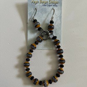 Handcrafted bead earrings and bracelet set in orange and black